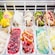 A freezer full of tubs containing a variety of flavors of gelato